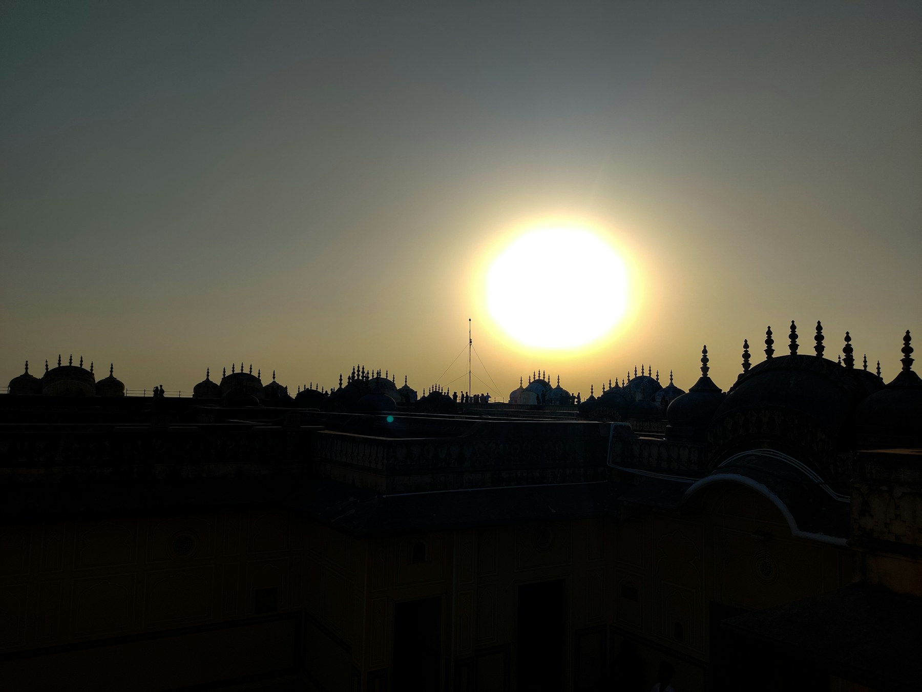 Warm light falling across the intricate architecture of a historic city
